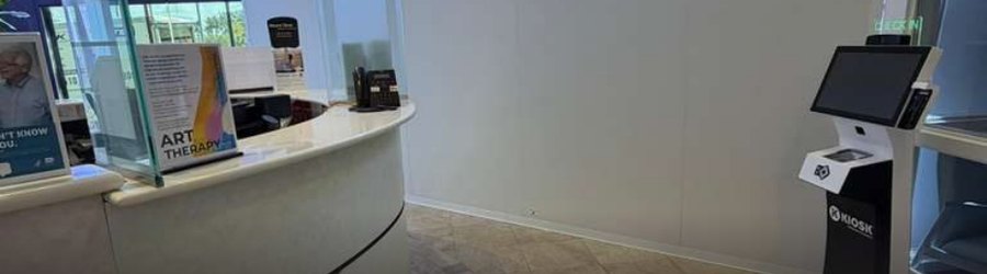 SwiftWall Pro barrier beside the live reception desk at Mount Sinai Medical Center, Miami Beach